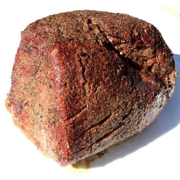 Nicely Browned, This Grilled Top Round Roast Is Ready To Slice